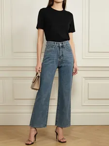 Fashionable mid-blue wide leg jeans featuring leopard heart pockets and a high-waisted fit