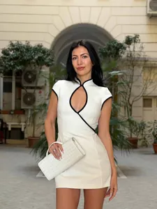 Close-up of white modern Qipao dress with teardrop cutout and elegant high collar