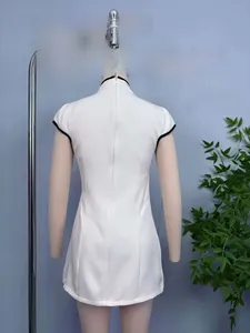 Detail view of the back zipper and black trim on a white modern Qipao short dress