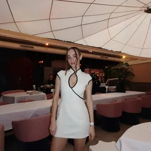 Modern white qipao dress with black trim and keyhole neckline for formal events