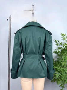 Detail of dark green trench coat back with storm flap and adjustable waist belt