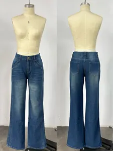 Detailed close-up showing washed texture and cat whisker whiskers on vintage blue jeans