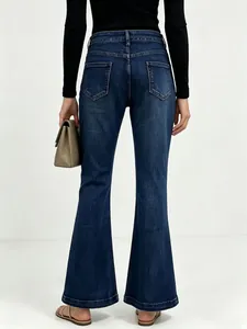Rear view of slim fit dark blue flare jeans with high waist and back pockets