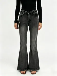 Detail of high waist slim fit flared denim jeans in vintage grey with front pockets