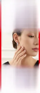 Close-up of elegant 925 sterling silver moissanite hoop earrings on a model's ear