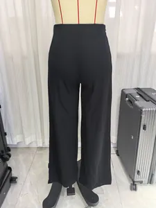 Rear view of black high-waisted wide-leg trousers with elegant tailored silhouette