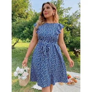 Blue floral sleeveless plus size dress with ruffle sleeves and waist tie in garden setting