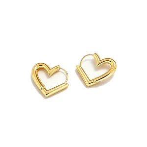 Polished gold heart hoop earrings for women with a minimalist asymmetric design