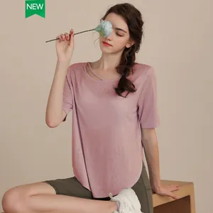 Pink Tencel yoga t-shirt for women with cutout neckline and curved hem for fitness