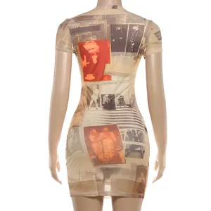 Close-up of the vintage newspaper print on a slim fit mesh short sleeve mini dress