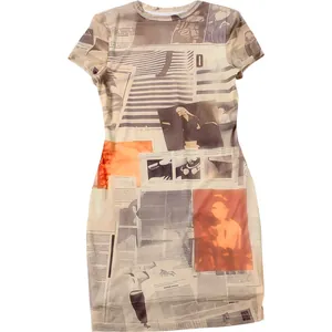 Detail of slim-fit mini dress showing newspaper print fabric and round neckline
