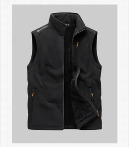 Detail of men's black fleece vest with orange zipper pulls and Free Spirit logo