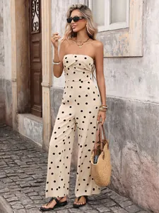 Polka dot strapless wide leg jumpsuit with black sunglasses and a woven handbag