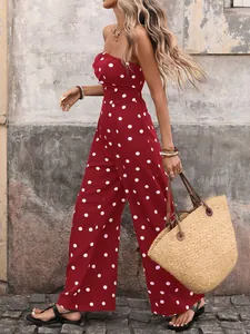 Detail shot of vintage red polka dot strapless jumpsuit with high-waist wide-leg fit