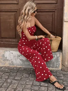 Close-up of red and white polka dot strapless jumpsuit with wide-leg tailoring