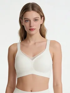 Detail of seamless wire-free V-neck bra with mesh insert and wide shoulder straps