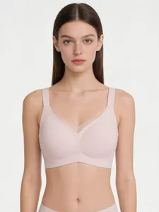 Close-up of pink wireless V-neck bra with breathable mesh detail and wide shoulder straps