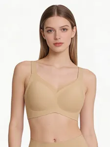 Close-up of nude seamless V-neck bra with wide straps and mesh support detail