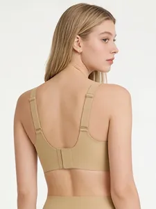 Detail of the seamless beige wireless bra featuring wide adjustable straps and back closure