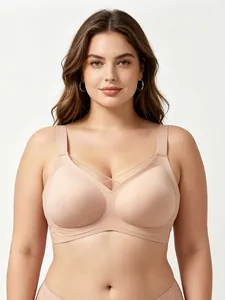 Close-up of nude V-neck sports bra with mesh paneling and soft wire-free support