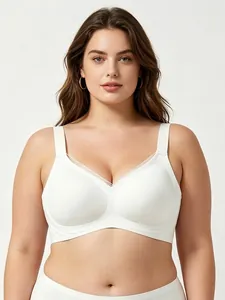 Detail of white wireless V-neck T-shirt bra with sheer mesh trim and wide straps
