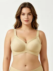 Close-up of seamless V-neck wireless beige bra with cross-strap detail on model