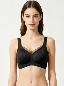 Close-up of black wireless V-neck bra featuring breathable mesh patchwork and wide straps