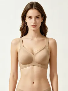 Close-up of nude wire-free V-neck bra with mesh detail and wide straps for soft support