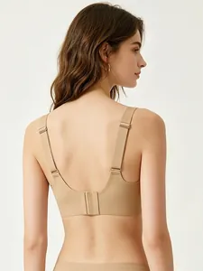 Close-up of seamless nude wireless bra featuring wide adjustable straps and back closure