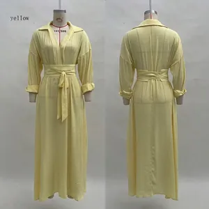 Front and back detail of a yellow V-neck pleated maxi dress with a waist tie belt