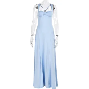 Close-up of light blue bodycon dress featuring elegant front twist knot and pleated details