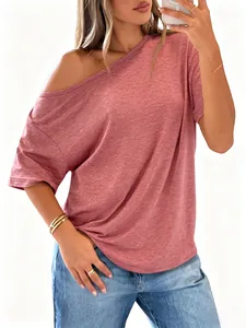 Detail of off-shoulder pink t-shirt showing soft marled texture and loose fit
