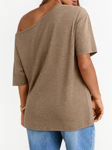 Macro detail of brown off-shoulder T-shirt showing fabric texture and soft drape