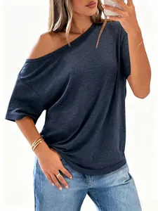 Detail of navy blue off-shoulder T-shirt with soft textured fabric on model