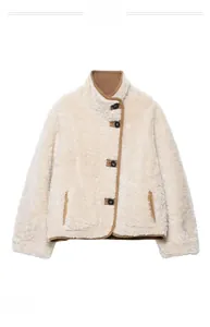 Detail of faux shearling jacket with brown trim and large contrast buttons