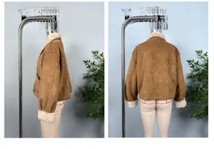 Detail view of reversible shearling jacket in brown faux suede with white faux fur trim