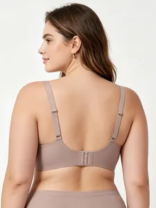 U-shaped back of seamless dusty pink bra with adjustable straps and soft texture