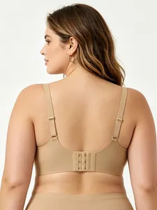 Detail of nude seamless bra featuring U-back design and adjustable wide straps