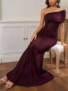 Detail of burgundy mesh one-shoulder dress showing elegant pleats and ruched texture