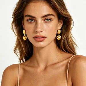 Polished 18K gold heart drop earrings for women with high-shine metallic finish