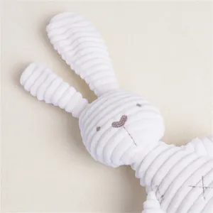 Detail of soft cream corduroy plush bunny with delicate embroidered facial features