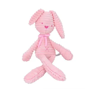 Pink long-eared plush bunny toy in corduroy fabric with a silk satin bow tie