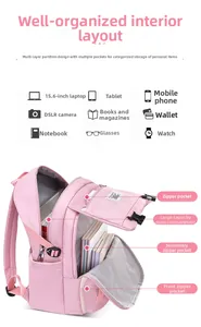Pink school backpack with multi-layer pockets holding a laptop, books, and accessories