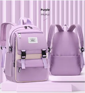 Detail view of purple student backpack with multi-pocket design and padded shoulder straps