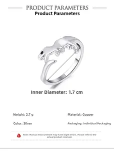 Detail view of silver dinosaur ring with copper material info and 1.7cm diameter