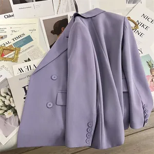 Detail of lavender double-breasted blazer sleeves with four decorative cuff buttons