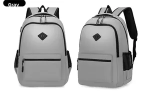 Front and side views of a grey travel backpack with mesh pockets and padded straps