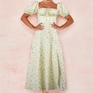 Detailed view of the square neckline and puffed short sleeves on this floral summer dress