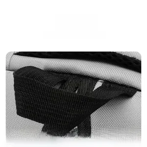 Detail shot of heavy-duty canvas backpack with reinforced black woven handle and stitching