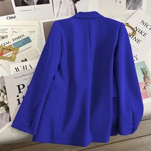 Back view of a slim fit Klein blue blazer featuring four buttons on the sleeve cuffs